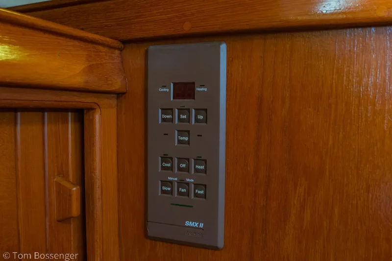 Slide: The Image of Control panel on 1997 Island Packet 45 yacht, mounted on wooden interior. - 22
