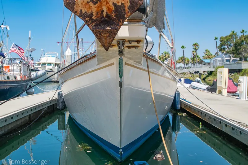 Slide: The Image of Front view of a 1997 Island Packet 45 sailboat docked in a marina. - 3
