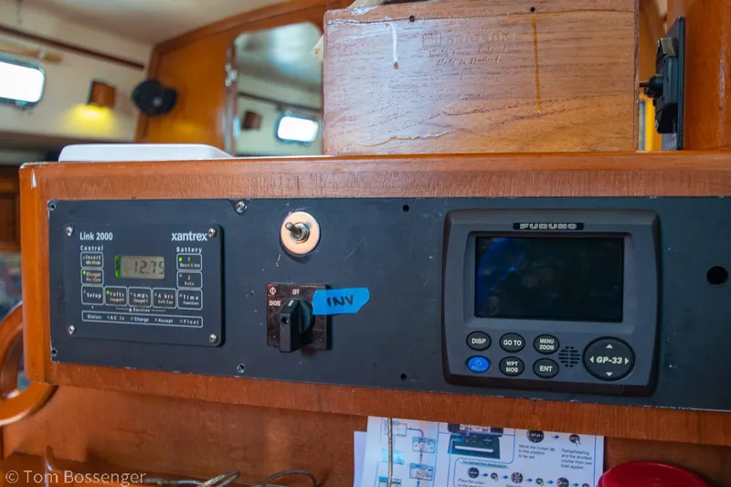 Slide: The Image of Control panel of a 1997 Island Packet 45 sailboat with navigation instruments. - 32