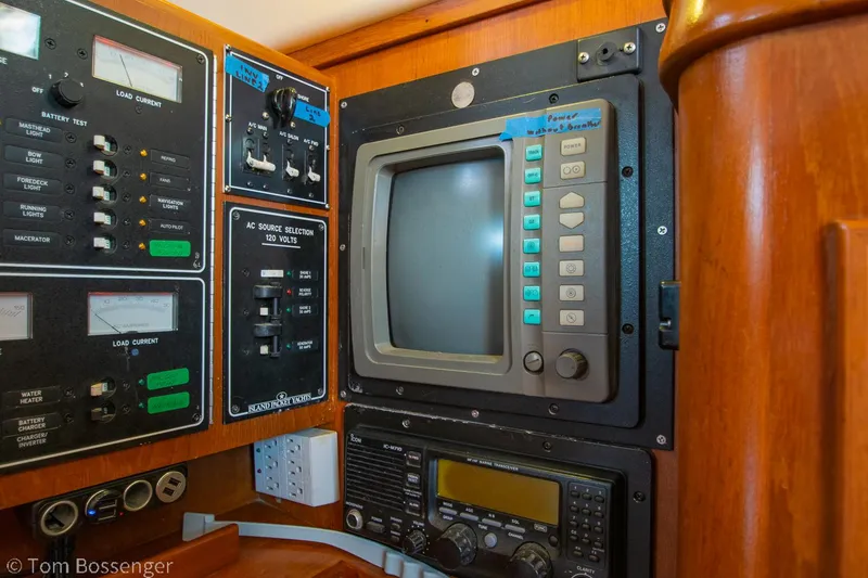 Slide: The Image of Control panel of a 1997 Island Packet 45 sailboat with navigation and communication equipment. - 34