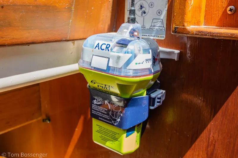 Slide: The Image of Emergency beacon on 1997 Island Packet 45 sailboat, mounted on wooden interior. - 35