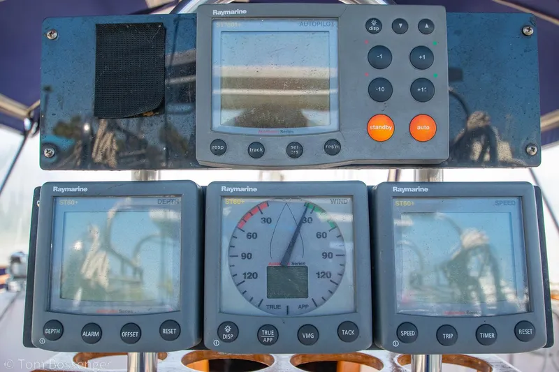 Slide: The Image of Raymarine navigation instruments on a 1997 Island Packet 45 sailboat dashboard. - 37