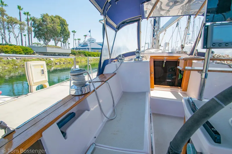 Slide: The Image of Cockpit view of a 1997 Island Packet 45 sailboat docked in a marina. - 39