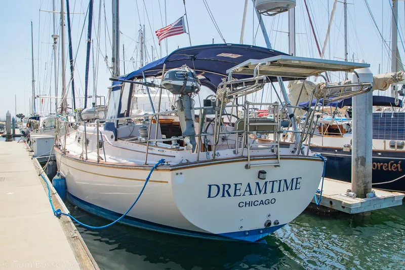 Slide: The Image of Island Packet 45 sailboat, 1997 model, named "Dreamtime," docked at a marina. - 4