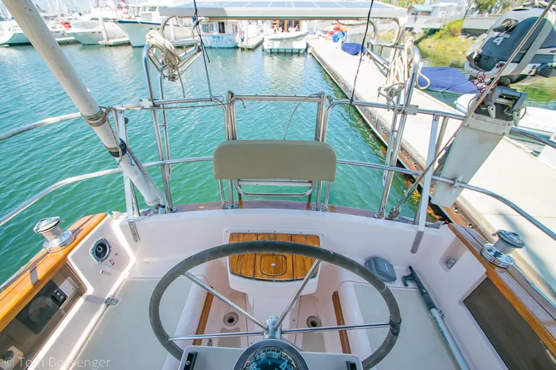 Slide: The Image of Cockpit view of a 1997 Island Packet 45 sailboat docked at a marina. - 40