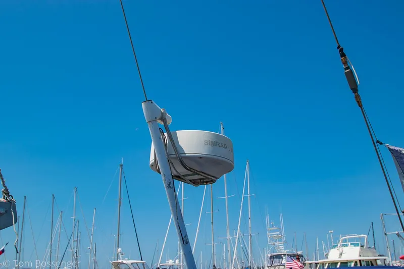 Slide: The Image of Radar equipment on a 1997 Island Packet 45 sailboat against a clear blue sky. - 48