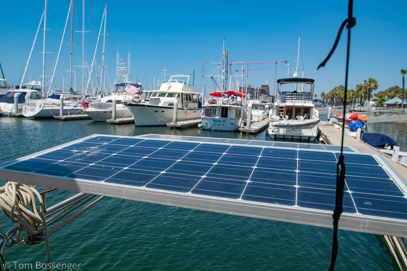 Slide: The Image of Solar panel on 1997 Island Packet 45 yacht in marina, surrounded by boats. - 49