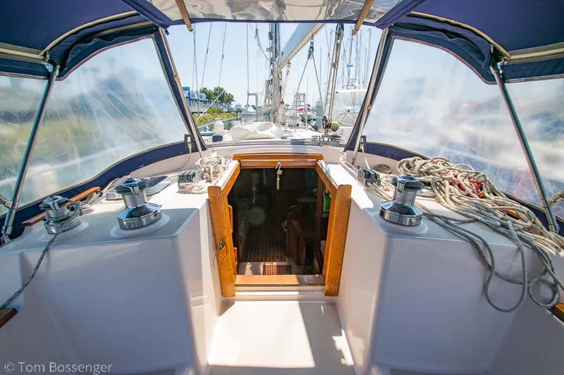 Slide: The Image of Cockpit view of 1997 Island Packet 45 sailboat with ropes and winches. - 6