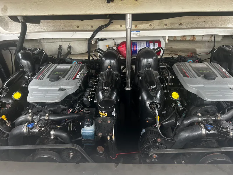 Slide: The Image of 2013 Sea Ray 300 SLX boat engine compartment with twin engines. - 11