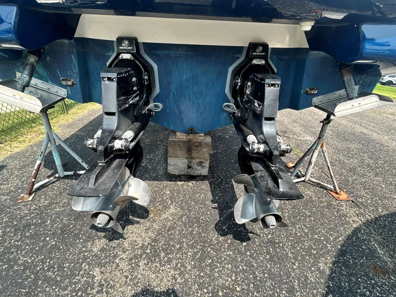 Slide: The Image of 2013 Sea Ray 300 SLX boat with dual propellers on stands. - 12