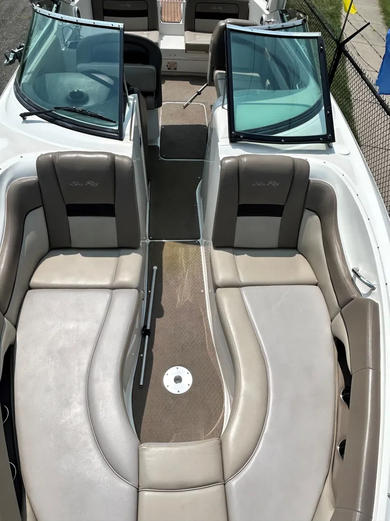 Slide: The Image of 2013 Sea Ray 300 SLX boat interior with beige and gray seating. - 18