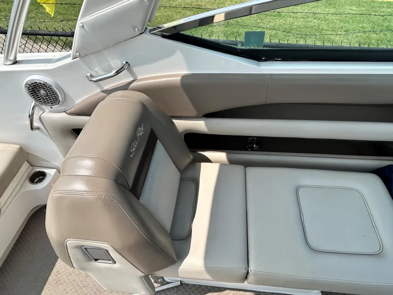 Slide: The Image of 2013 Sea Ray 300 SLX boat interior with beige seating and speaker. - 21