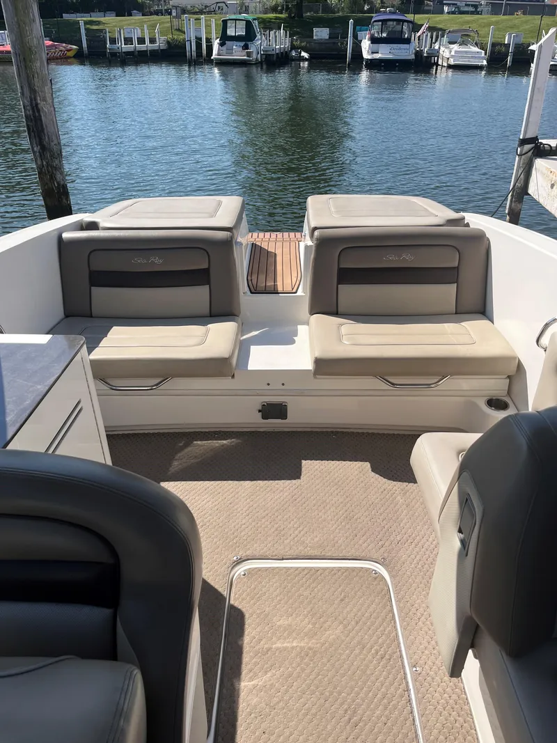 Slide: The Image of 2013 Sea Ray 300 SLX boat interior with seating, docked at marina. - 5