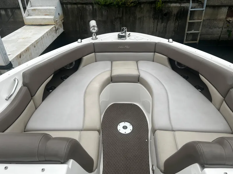 Slide: The Image of 2013 Sea Ray 300 SLX boat interior with cushioned seating and a non-slip floor. - 6