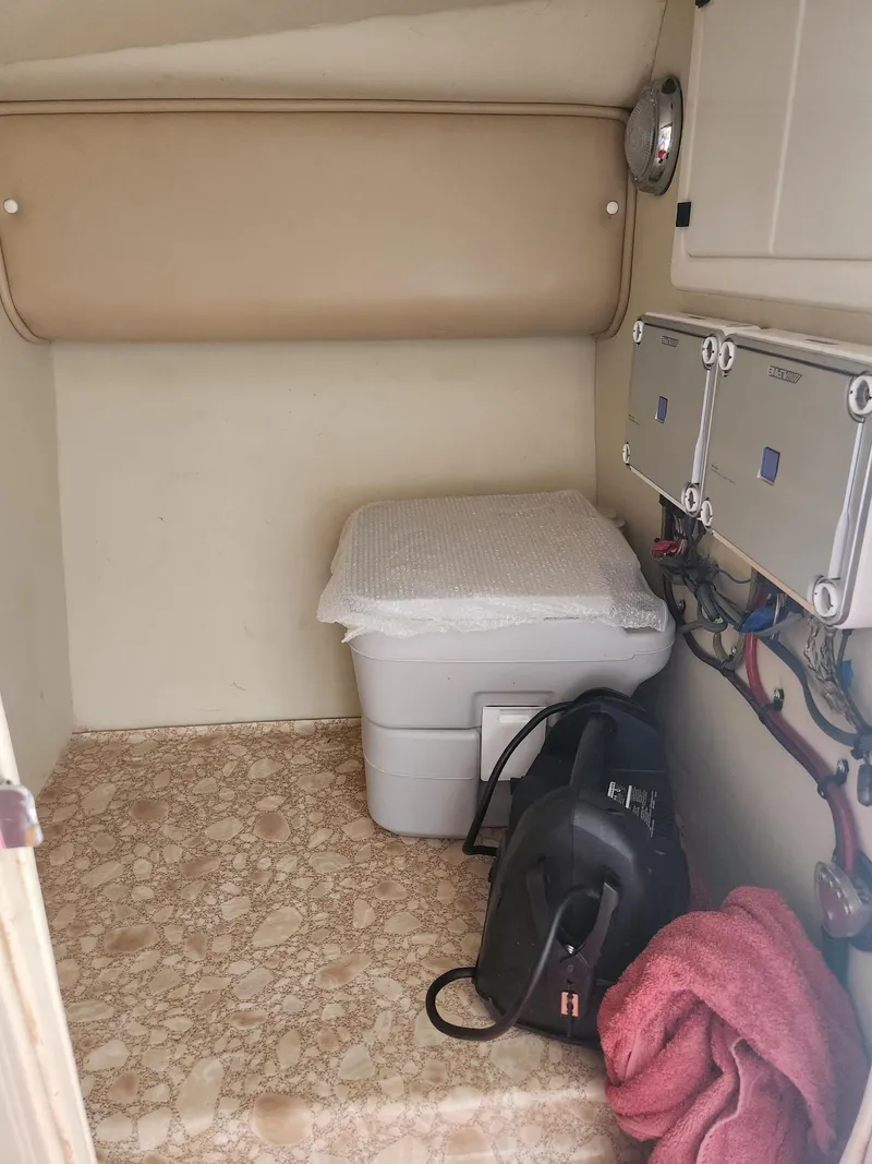 Slide: The Image of Storage compartment in a 2004 Eliminator 380 Eagle boat with equipment and accessories. - 9