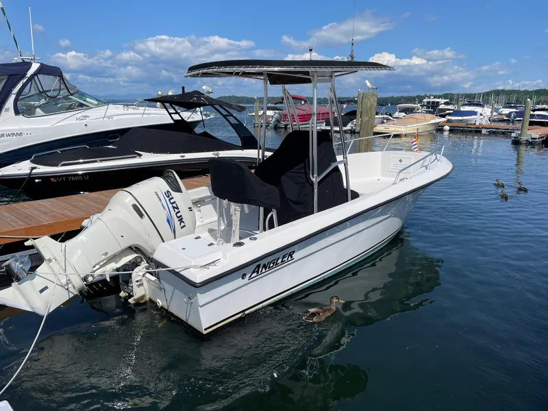 The Image of 2002 Angler 204CC boat docked at marina. - 1