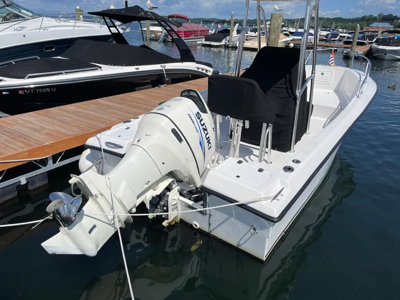 Slide: The Image of Angler 204CC 2002 boat docked with Suzuki outboard motor. - 3