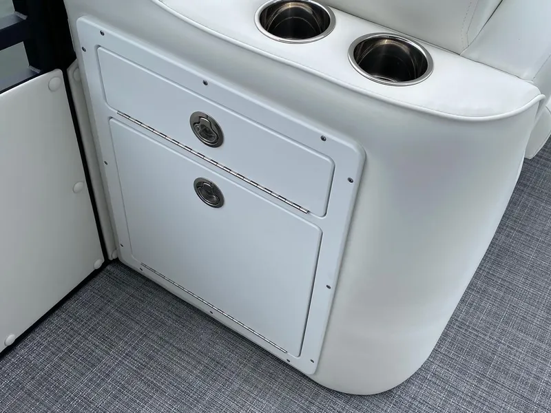 Slide: The Image of 2024 JC Neptoon Sport 23TT DSL storage compartment and cup holders. - 11