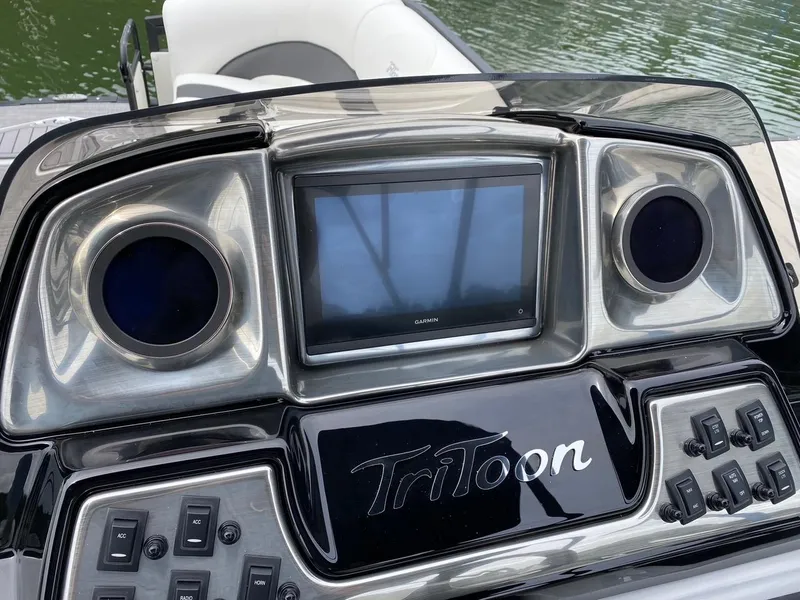 Slide: The Image of 2024 JC Neptoon Sport 23TT DSL dashboard with touchscreen and controls. - 18