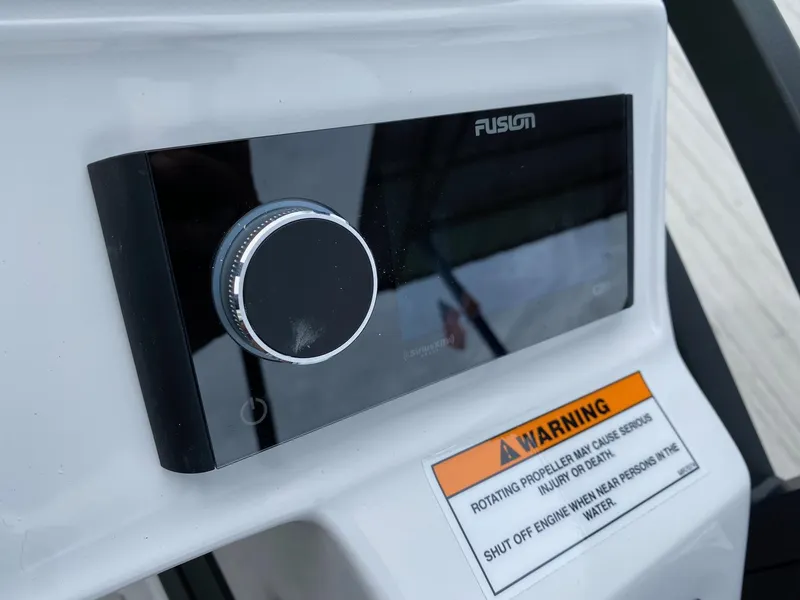 Slide: The Image of Fusion audio control panel on 2024 JC Neptoon Sport 23TT DSL boat. - 19