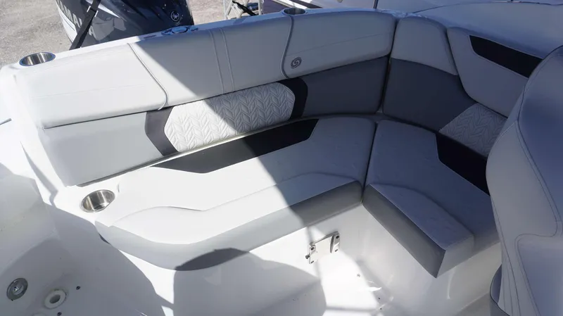 Slide: The Image of 2024 Hurricane 2200 SD boat interior with gray and white seating. - 11
