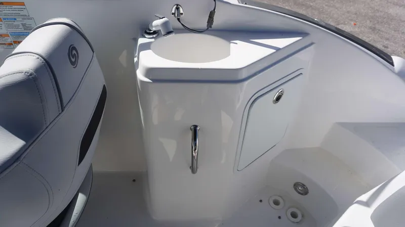 Slide: The Image of 2024 Hurricane 2200 SD boat interior with sink and storage compartment. - 12
