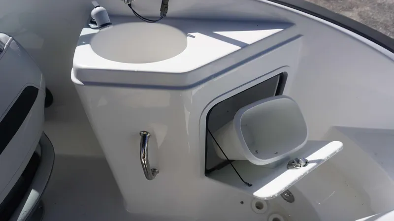 Slide: The Image of 2024 Hurricane 2200 SD boat interior with sink and storage compartment. - 13