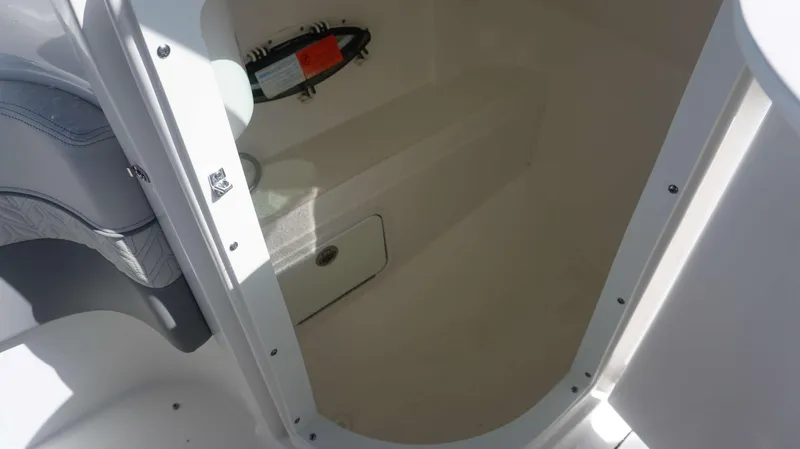 Slide: The Image of 2024 Hurricane 2200 SD boat interior storage compartment. - 17