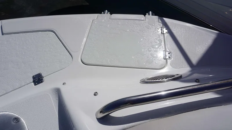 Slide: The Image of 2024 Hurricane 2200 SD boat deck with sleek design and stainless steel railing. - 19