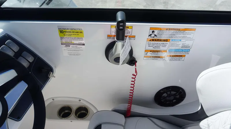 Slide: The Image of 2024 Hurricane 2200 SD boat dashboard with capacity and safety warnings. - 21