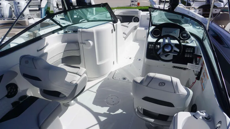 Slide: The Image of 2024 Hurricane 2200 SD boat interior with modern seating and steering console. - 4