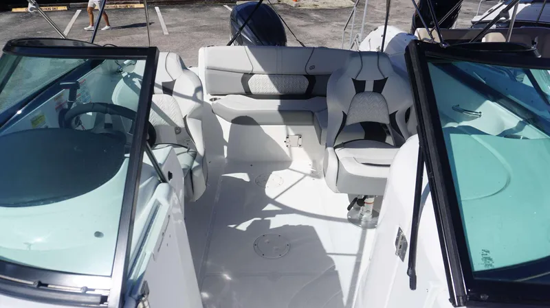 Slide: The Image of 2024 Hurricane 2200 SD boat interior with seating and steering wheel. - 7