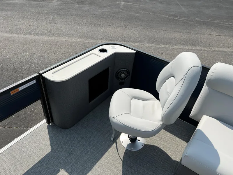 Slide: The Image of 2024 Crest Classic Fish 220 boat interior with swivel seat and console. - 20