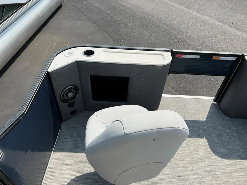 Slide: The Image of 2024 Crest Classic Fish 220 boat interior with seating and control panel. - 21