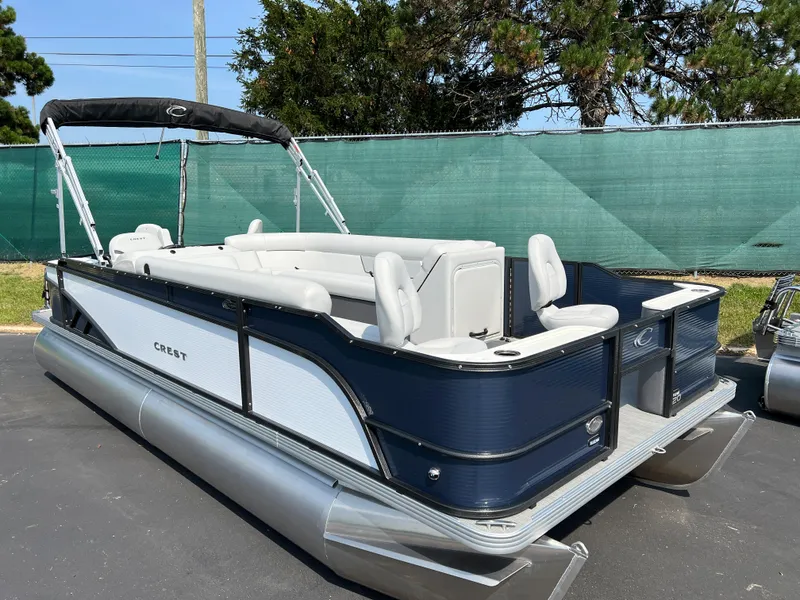 Slide: The Image of 2024 Crest Classic Fish 220 pontoon boat with sleek design and comfortable seating. - 4