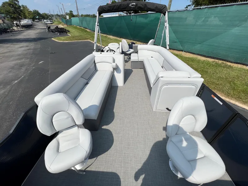 Slide: The Image of 2024 Crest Classic Fish 220 pontoon boat with spacious seating and modern design. - 5