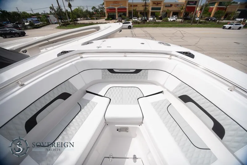 Slide: The Image of 2024 Blackfin 272 CC boat interior with white seating and modern design. - 12