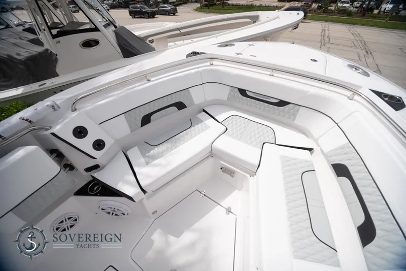Slide: The Image of 2024 Blackfin 272 CC boat interior with white seating and sleek design. - 13