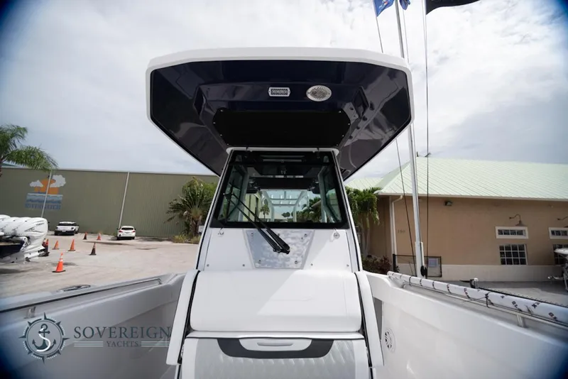 Slide: The Image of 2024 Blackfin 272 CC boat at Sovereign Yachts dealership, front view. - 16