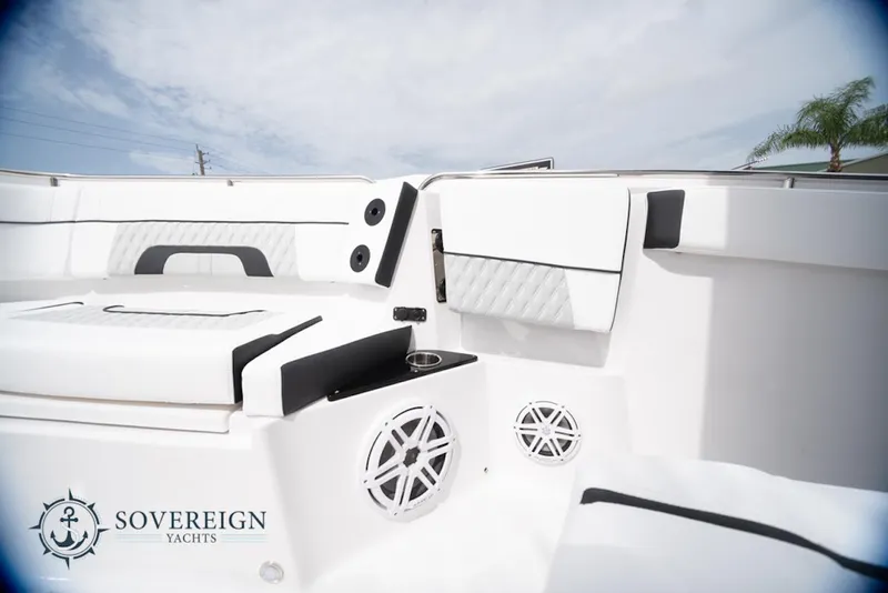 Slide: The Image of 2024 Blackfin 272 CC boat interior with sleek white seating and modern design. - 17