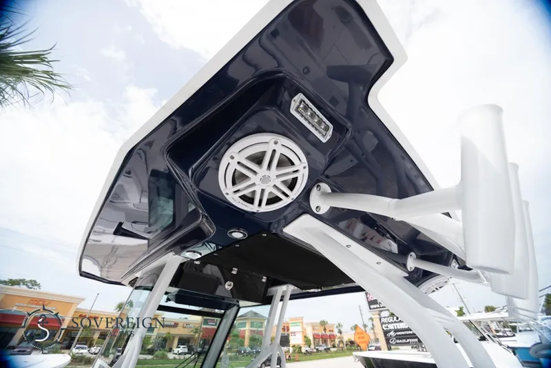 Slide: The Image of 2024 Blackfin 272 CC boat with sleek design and integrated speaker system. - 23