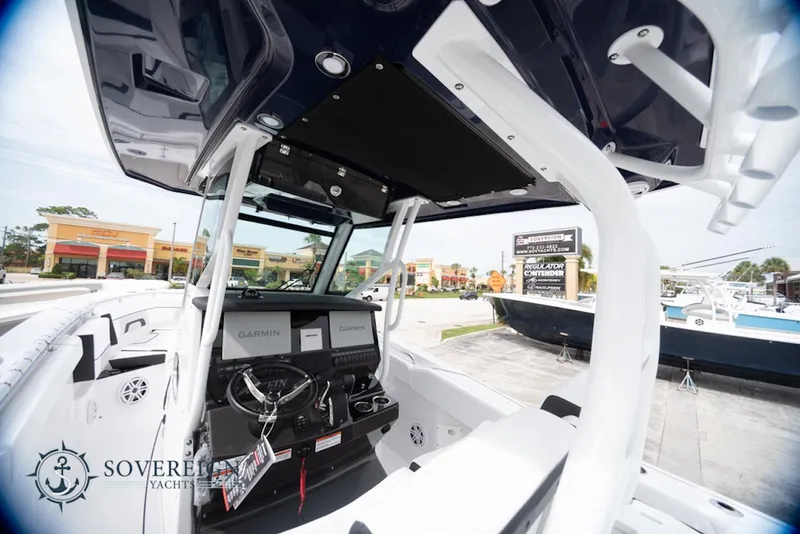 Slide: The Image of 2024 Blackfin 272 CC boat interior with modern dashboard and controls. - 24