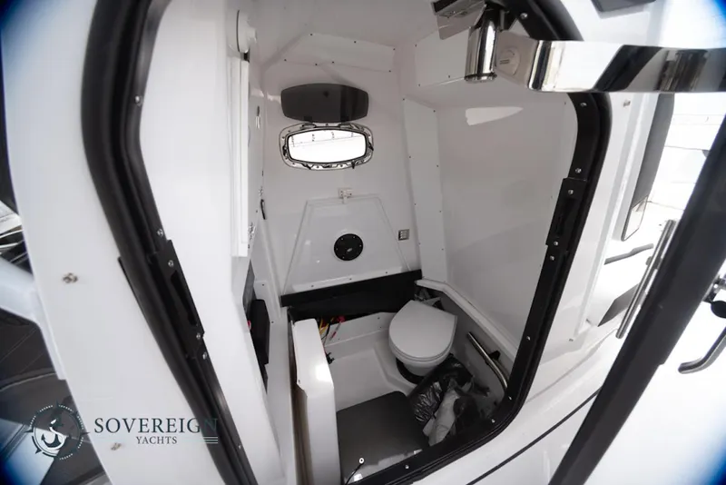 Slide: The Image of Interior of 2024 Blackfin 272 CC boat cabin with compact toilet. - 25
