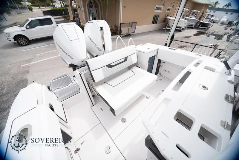 Slide: The Image of 2024 Blackfin 272 CC boat interior with seating and twin outboard engines. - 33