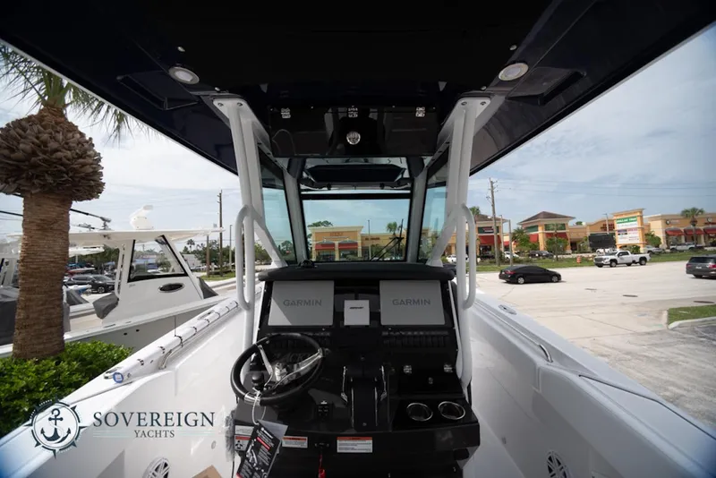Slide: The Image of 2024 Blackfin 272 CC boat cockpit with Garmin displays, showcased by Sovereign Yachts. - 9