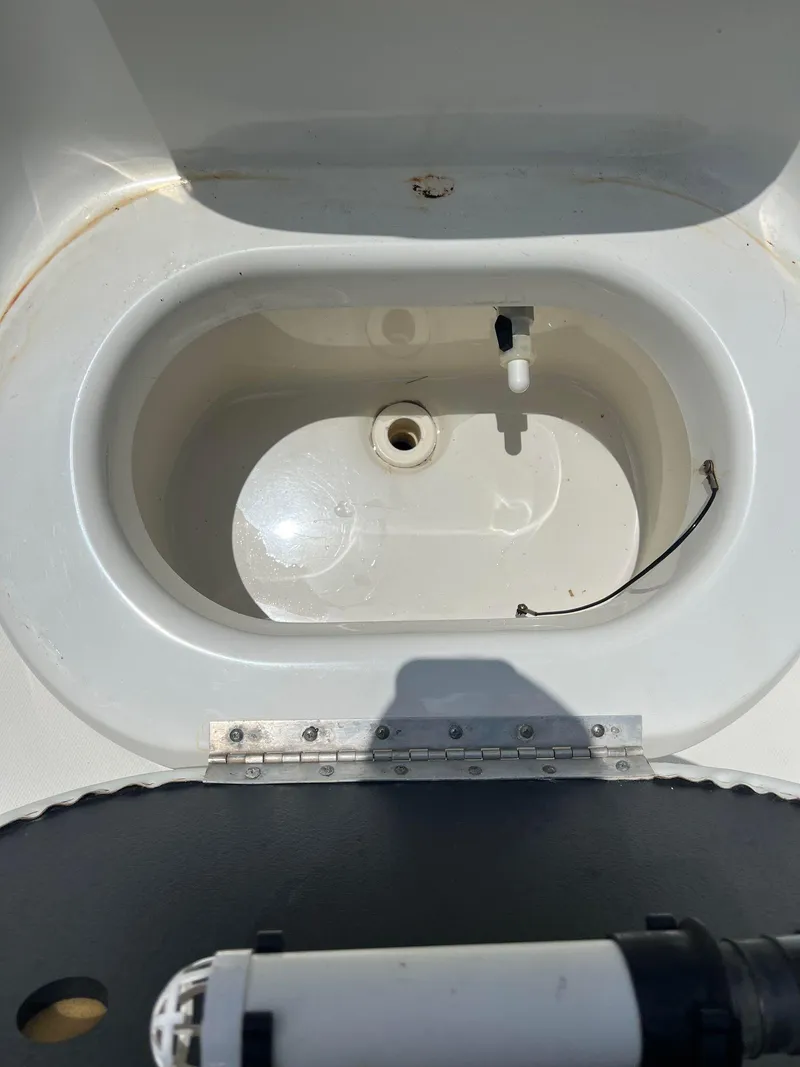 Slide: The Image of 2015 NauticStar 2110 Sport boat livewell interior view. - 14