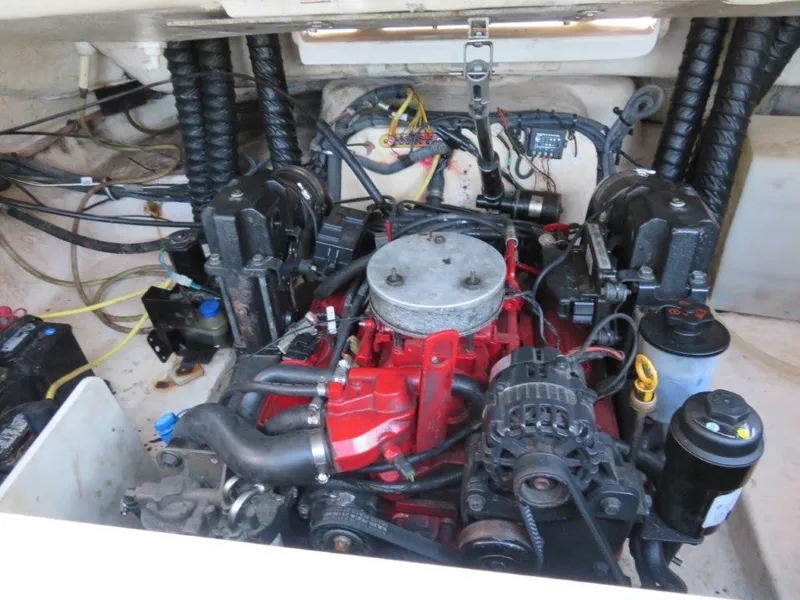 Slide: The Image of Engine compartment of a 2004 Chaparral 256 SSi boat, showcasing mechanical components. - 12