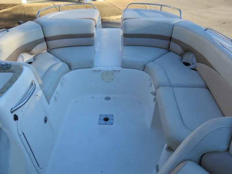 Slide: The Image of 2004 Chaparral 256 SSi boat interior with spacious seating and sleek design. - 5
