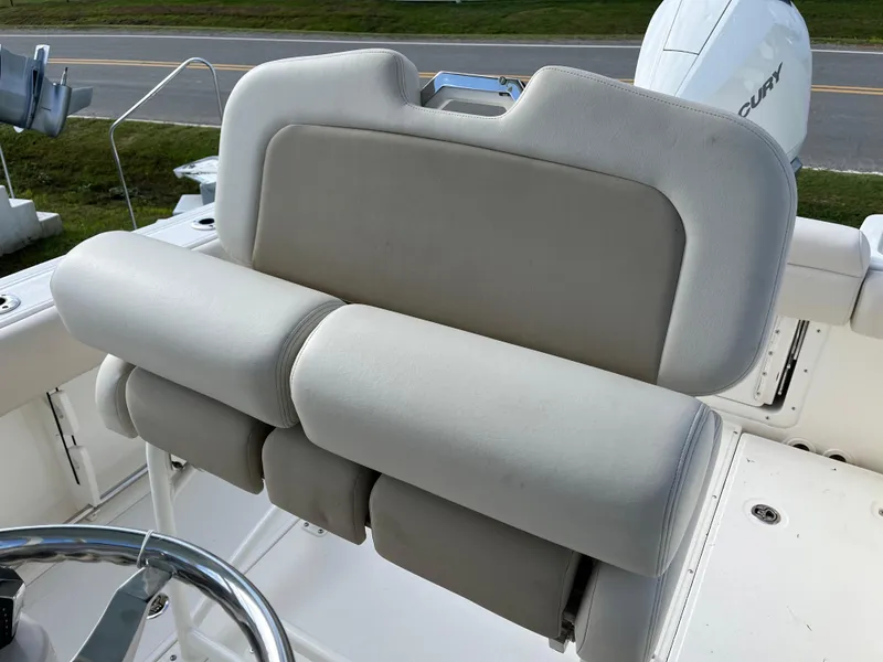 Slide: The Image of 2024 Boston Whaler 230 Outrage boat seating and helm detail. - 11