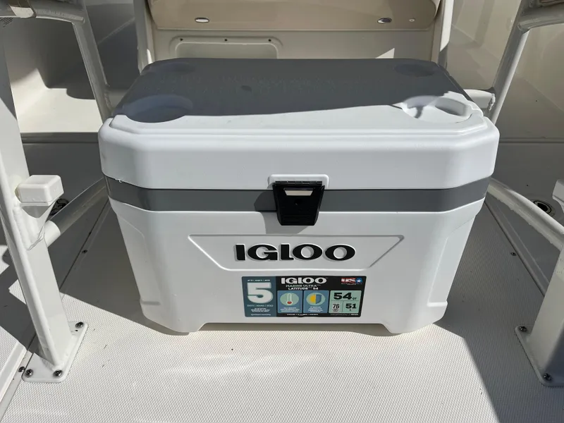 Slide: The Image of Igloo cooler on 2024 Boston Whaler 230 Outrage boat deck, perfect for marine adventures. - 26